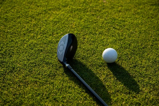 Golf player playing in a golf club on a beautiful sunset in the evening