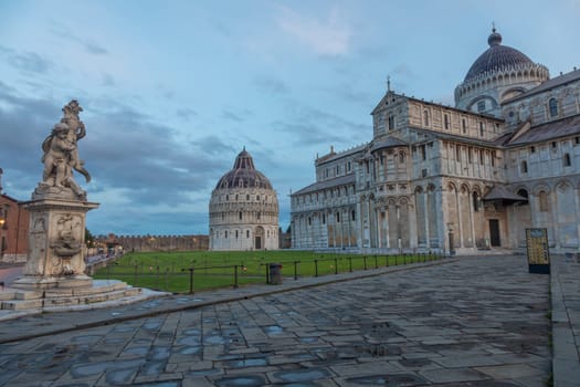Pisa, Italy - 29 June 2023. Cathedral exterior with baptistery, early morning light