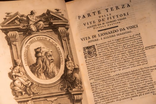 Turin, Italy - 22 August 2023. Royal Museum. Detail of Giorgio Vasari book - Le Vite, 1550. Page with Leonardo da Vinci portrait