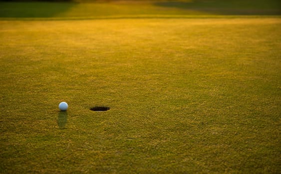 Golf course with ball and grass
