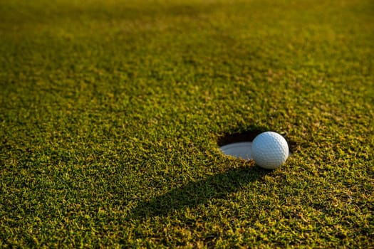 Close up of golf ball on green grass, Sport and lifestyle