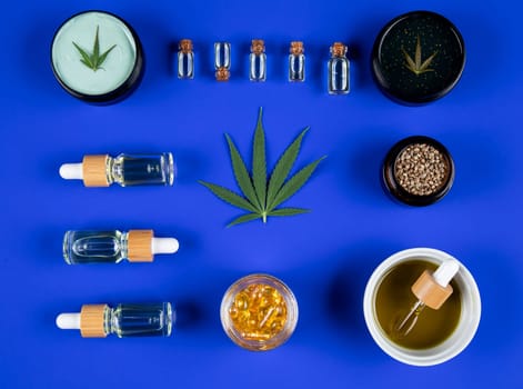 Marijuana buds with cannabis leaves on cbd concept