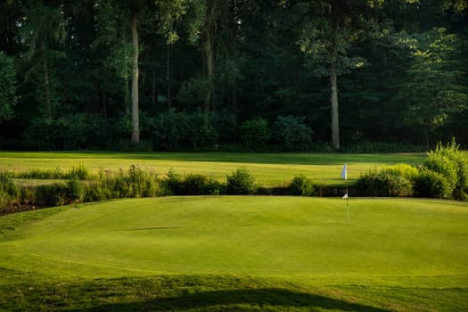 Golf course with green grass