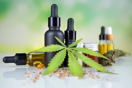Hemp oil and marijuana leaves on extract cbd