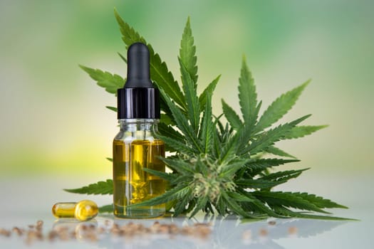 Bottles with hemp oil and cannabis leaves, marijuana