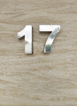 House number 17. Silver over travetine stone slate