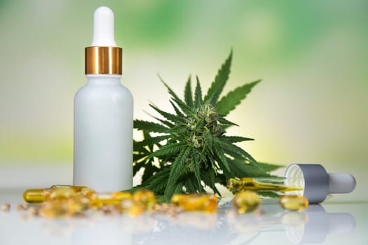 Hemp oil and marijuana leaves on extract cbd