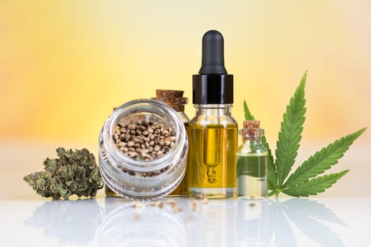 Bottles with hemp oil and cannabis leaves, marijuana