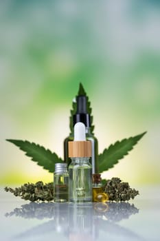 Hemp cbd oil, cannabis leaves, hemp seeds and bottles of oil