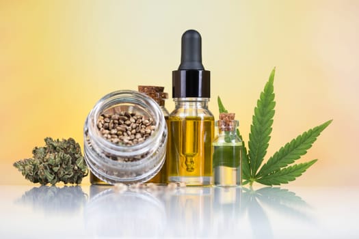 Bottles with hemp oil and cannabis leaves, marijuana