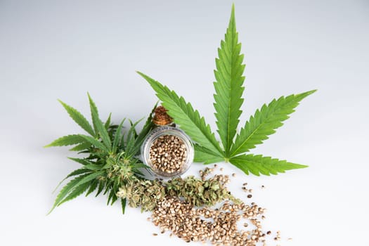 Bottles with hemp oil and cannabis leaves, marijuana