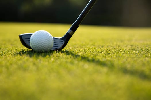 Playing a golf on a beautiful sunset in the evening