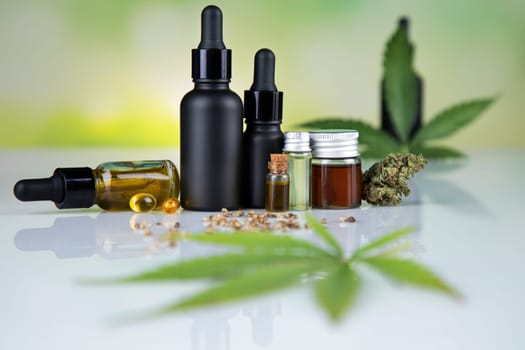 Hemp oil and marijuana leaves on extract cbd