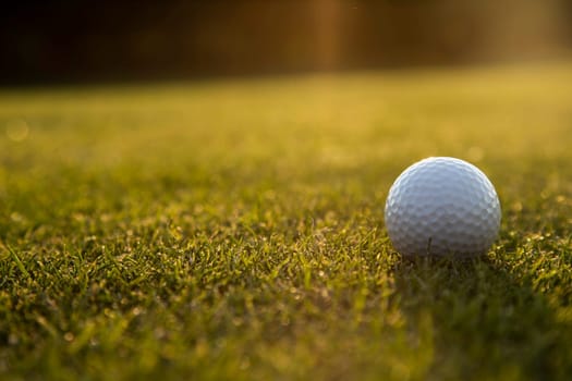 Golf ball, course on a sunny day