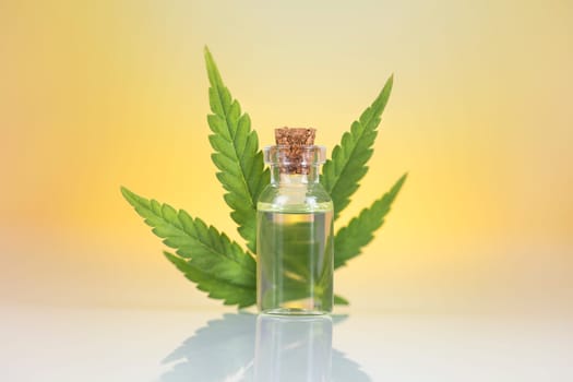 Bottles with hemp oil and cannabis leaves, marijuana