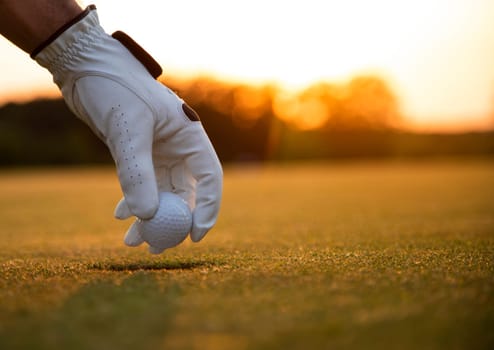 Golf player playing in a golf club on close up of a hand