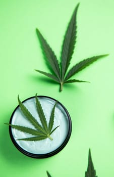 Marijuana buds with cannabis leaves on cbd concept