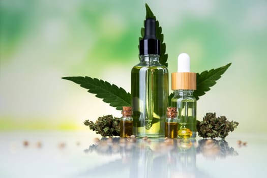 Hemp oil and marijuana leaves on extract cbd