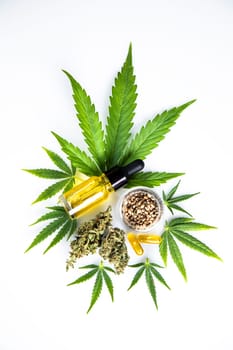 Hemp oil and marijuana leaves on extract cbd