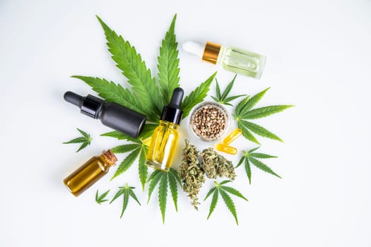 Bottles with hemp oil and cannabis leaves, marijuana