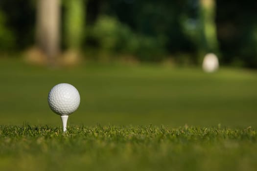 Golf course with ball and grass