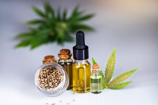 Hemp oil and marijuana leaves on extract cbd