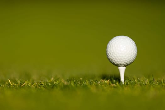 Golf course with ball and grass