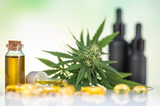Bottles with hemp oil and cannabis leaves, marijuana