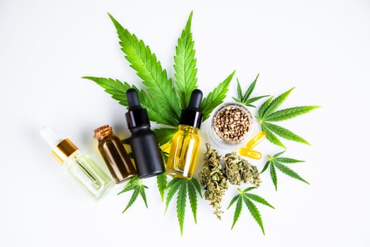 Hemp oil and marijuana leaves on extract cbd