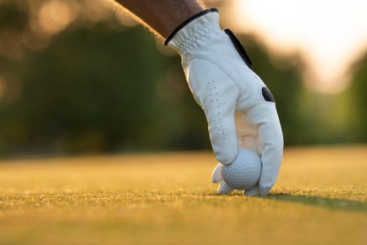 Golf player playing in a golf club on close up of a hand