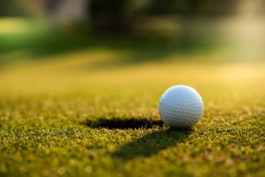 Golf ball, course on a sunny day