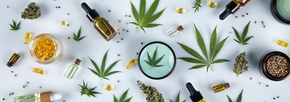 Cannabis hemp oil bottle with hemp seeds, hemp leaf, cannabis oil and marijuana