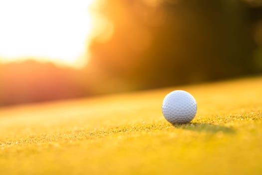 Golf ball, course on a sunny day