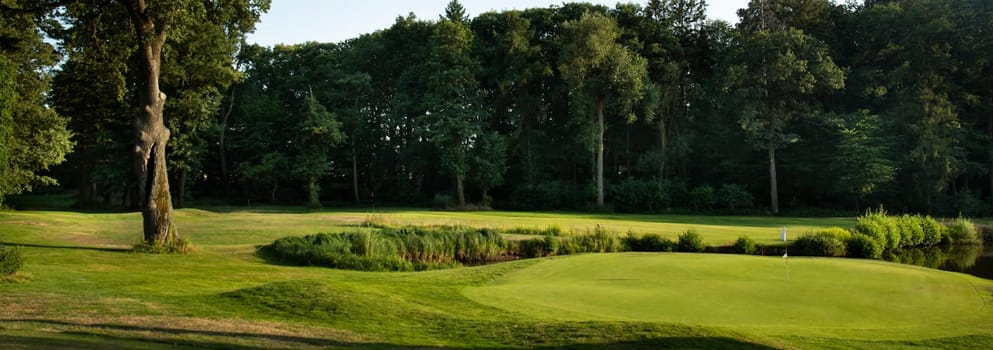 Golf course with green grass
