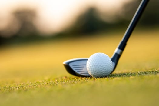 Playing a golf on a beautiful sunset in the evening