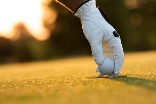 Golf player playing in a golf club on close up of a hand