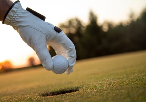 Golf player playing in a golf club on close up of a hand
