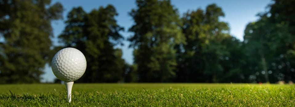 Golf ball and clubs in golf field