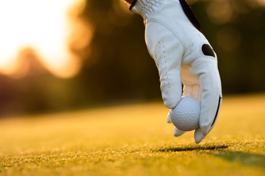 Golf player playing in a golf club on close up of a hand