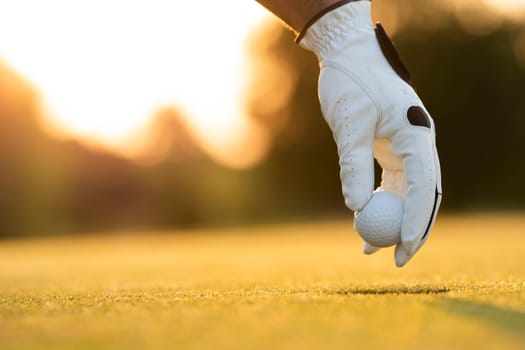 Golf player playing in a golf club on close up of a hand