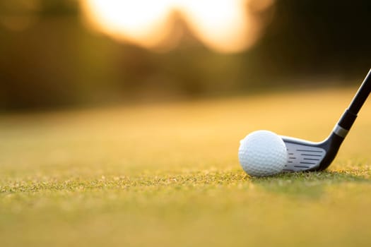 Playing a golf on a beautiful sunset in the evening