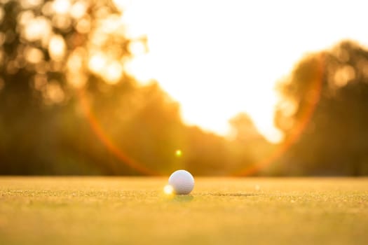 Golf ball, course on a sunny day
