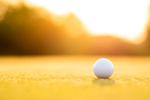 Golf ball, course on a sunny day
