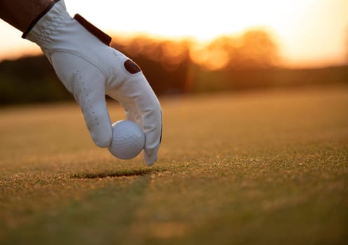 Golf player playing in a golf club on close up of a hand