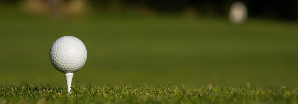 Golf course with ball and grass