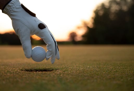 Golf player playing in a golf club on close up of a hand