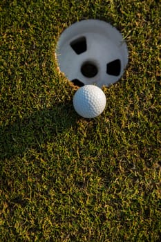 Close up of golf ball on green grass, Sport and lifestyle