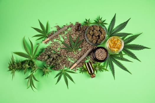 Composition with marijuana leaves, bottle of oil, cannabis on cbd