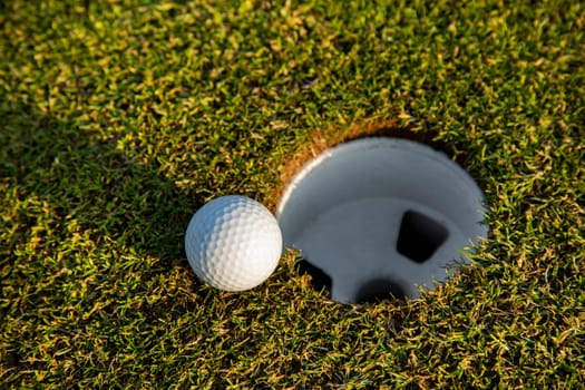 Sport and lifestyle, Golf ball on green grass on course