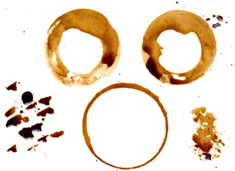 Spilled coffee with drops and splashes, round imprints from a cup on an isolated background, set